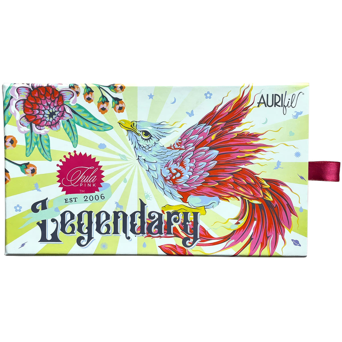 A rectangular illustrated product box for Aurifil Tula Pink 'Legendary', featuring a colorful bird and floral design on a pale yellow-green sunburst background, with a small pink ribbon tag on the right side.