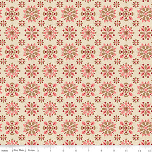Patterned fabric with pink and brown flowers on a beige background with a ruler along the bottom for scale. 