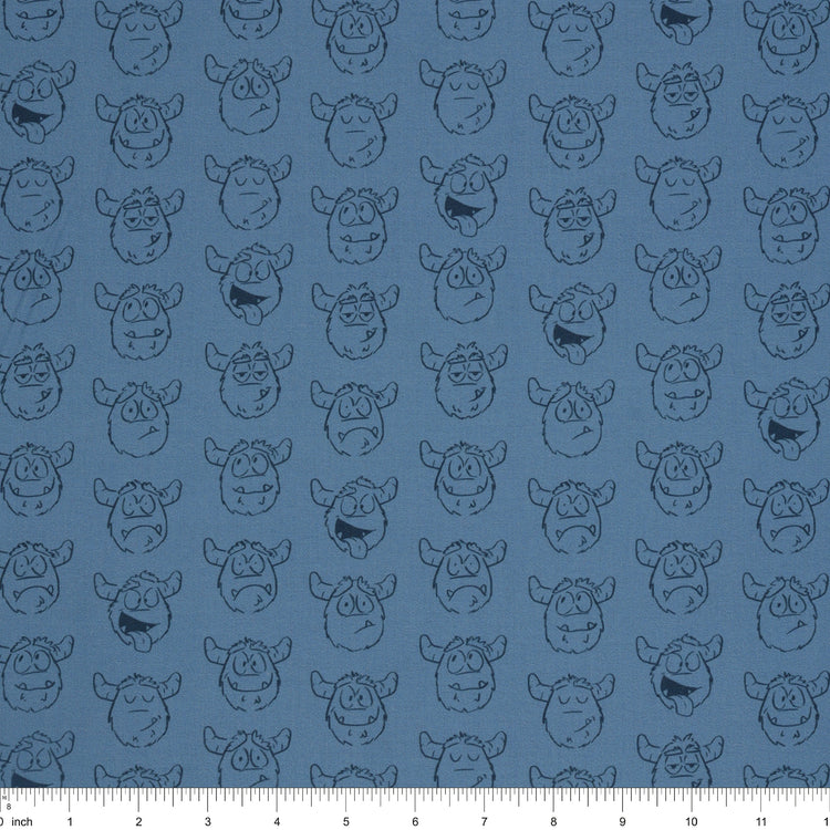 Yeti-tude Blue fabric with rows of expressive yeti faces outlined in navy on a muted blue background with ruler for scale.